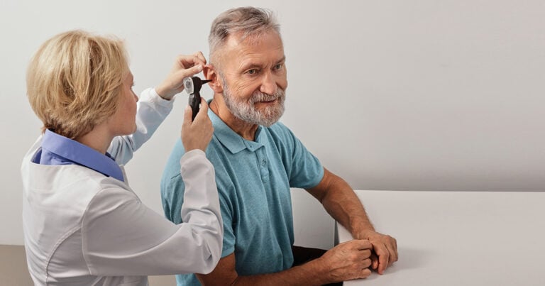 Audiologist with Patient